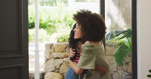 Mother and daughter hugging each other