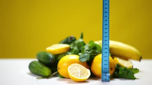 Fresh Fruits and Vegetables with Measuring Tape