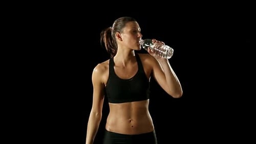 Athletic Woman Drinking Water After Workout