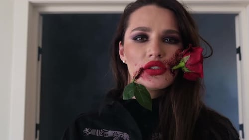 Woman Posing with Rose and Special Effects Makeup