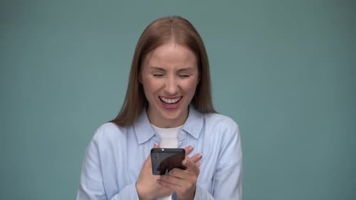 Woman Laughing Hysterically at Phone Content