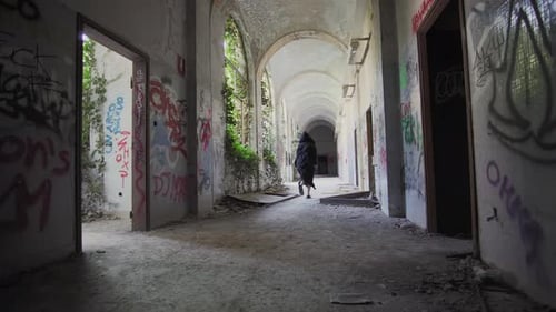 killer carry a big knife follow a girl in abandoned place violence against women concept