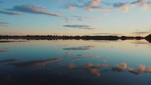 Panorama of the Lake at Sunset. The Lake Reflects the Sky