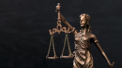 Themis Statue Of The Lady Justice On Black Background. Legal law concept.