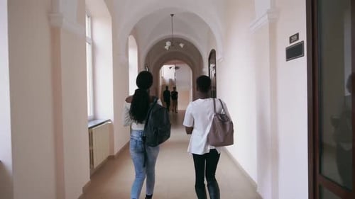 Two Girls Walking By Two Handsome Boys in University
