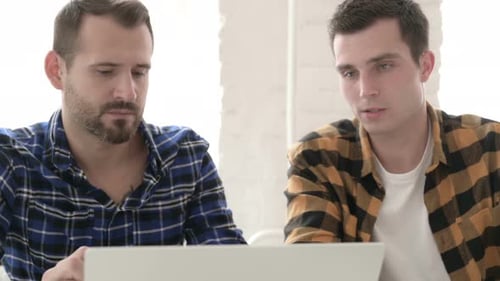 Close Up of Creative People Discussing Work on Laptop, Talking