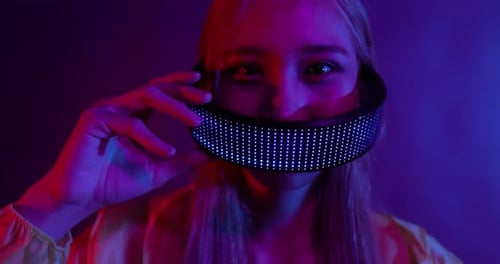 Young Asian woman playing metaverse virtual reality digital technology game with VR goggle.