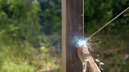 Close View Plank Connected to Pole with Welding Machine