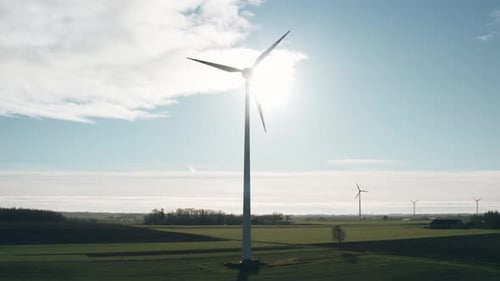 Aerial Drone View Windmills Wind Turbines Producing Clean Ecological Electricity By Road in Green