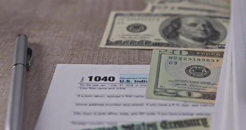 US Tax Form with Money and Calculator