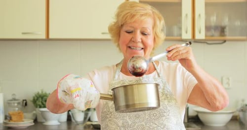 Mature Woman Cooking in Bright Kitchen