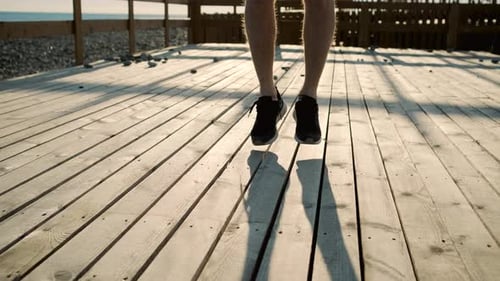 Athletic Person Jumping Rope at Beach During Sunset