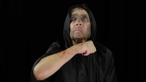 Man in Ghoul Makeup and Black Hooded Robe