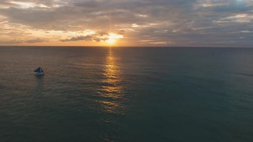Ocean View with Sailboat at Sunrise or Sunset