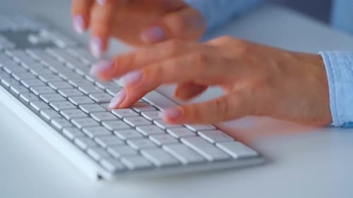 Woman's Hands Typing on Computer Keyboard
