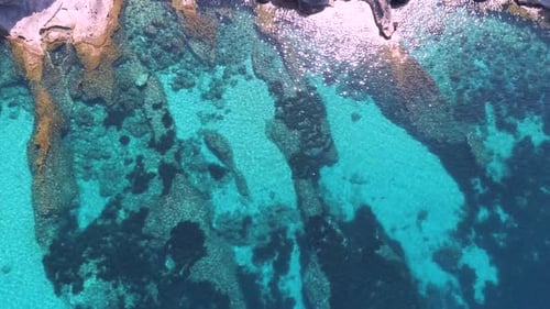 Transparent sea water near stony remote coast