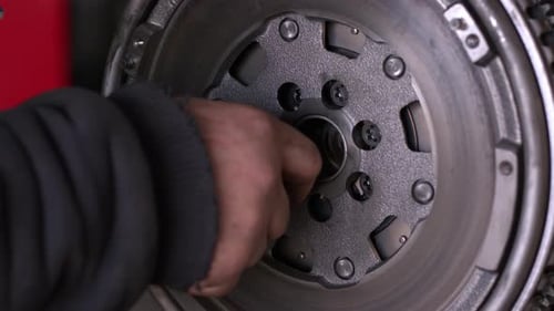 Flywheel Is Mounted To The Repaired Car Engine 3