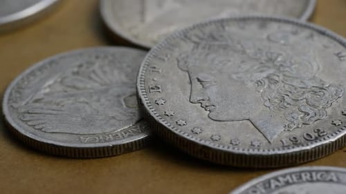 Close Up of Silver Coins on Table