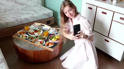 Blogger Woman Make Selfie Photos with Breakfast in Hotel Room