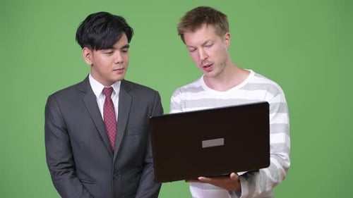 Colleagues Reviewing Laptop Together