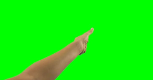 Person making hand gesture against green screen background