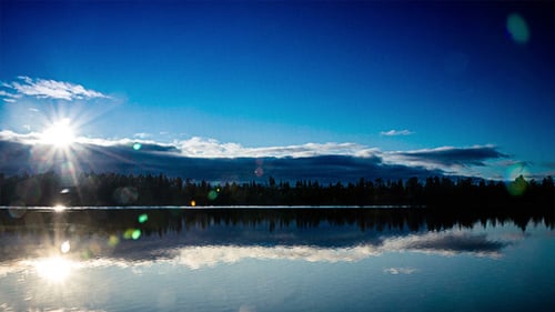 Clouds and Sun Over the Lake