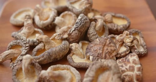 Dried Shiitake Mushrooms on Wooden Surface