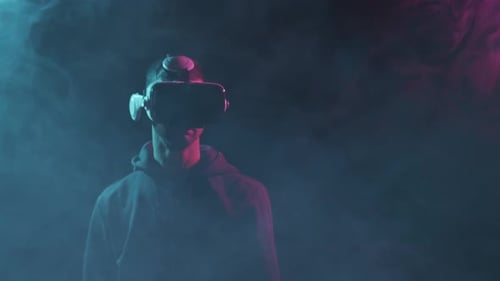 Young Adult Wearing VR Headset in Smoky Room