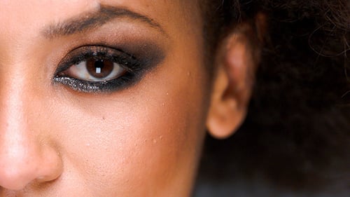 Woman's eye with dark makeup, close up