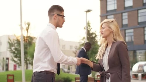 Business People Meeting and Shaking Hands Outdoors