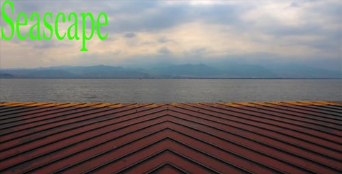 Tranquil Ocean Horizon and Distant Mountains