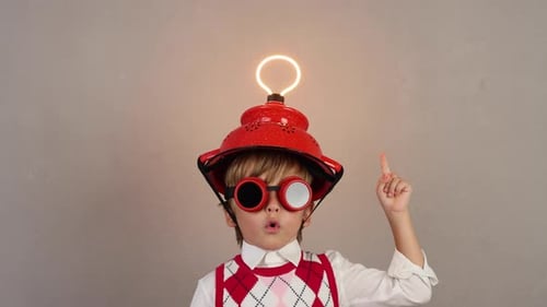 Child Inventor with Colander Helmet Receives an Idea