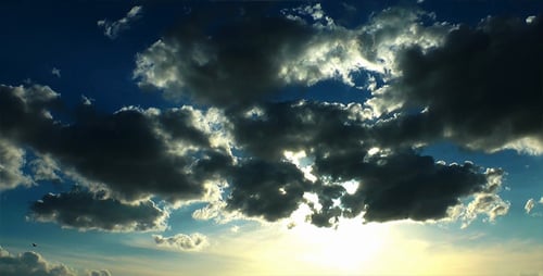 Dramatic Clouds and Radiant Sun in the Sky
