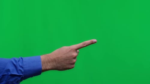 Male Hand with Pointing Finger on Isolated Green Background