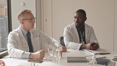 Medical Professionals Meeting and Discussing Data