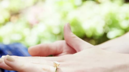 Woman hand wearing engagement ring