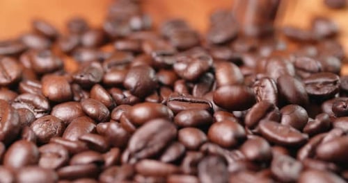 Roasted Coffee Beans Poured in Macro Close Up