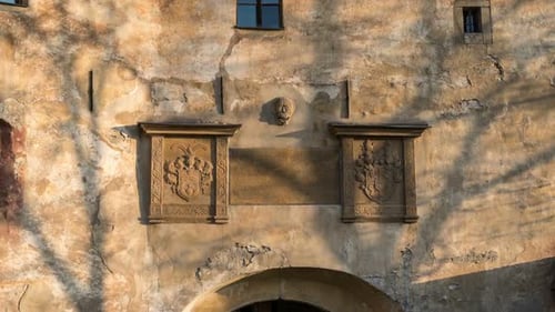 Exterior Wall of Old Building with Stone Carvings