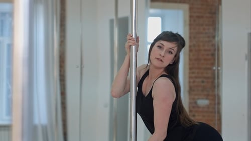 Young pole dancer woman wearing balck sports wear training