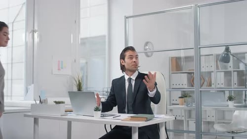 Enthusiastic Colleagues Celebrate Success in Modern Office