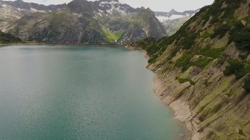 mountain lake in the swiss alps, reservoir in the middle of the mountains