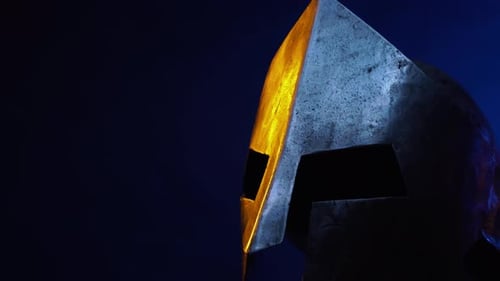 Metallic Spartan Helmet Close Up Against Blue
