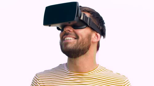 Man Wearing VR Headset Smiling and Looking Up
