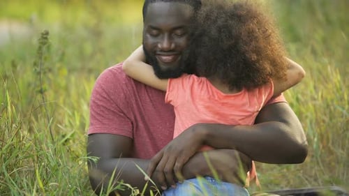 Happy Child Hugging Smiling Father Outdoors