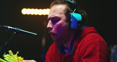 Sound Designer Imitating Eating and Laugh Noises