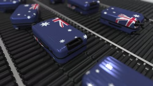 Moving Australian Flag Luggage on Airport Conveyor Belt