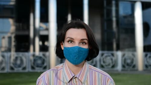 Woman Wearing Face Mask in City Environment