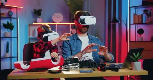Father and Child Using Virtual Reality Headsets Together