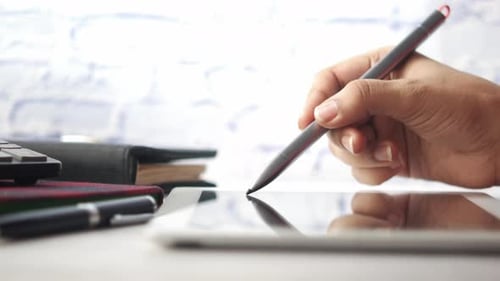 Hand Using Stylus on Tablet Device
