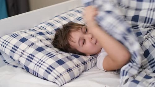 Child Was Lying on the Bed in a Good Mood the Child Recovered From the Illness and Felt Good